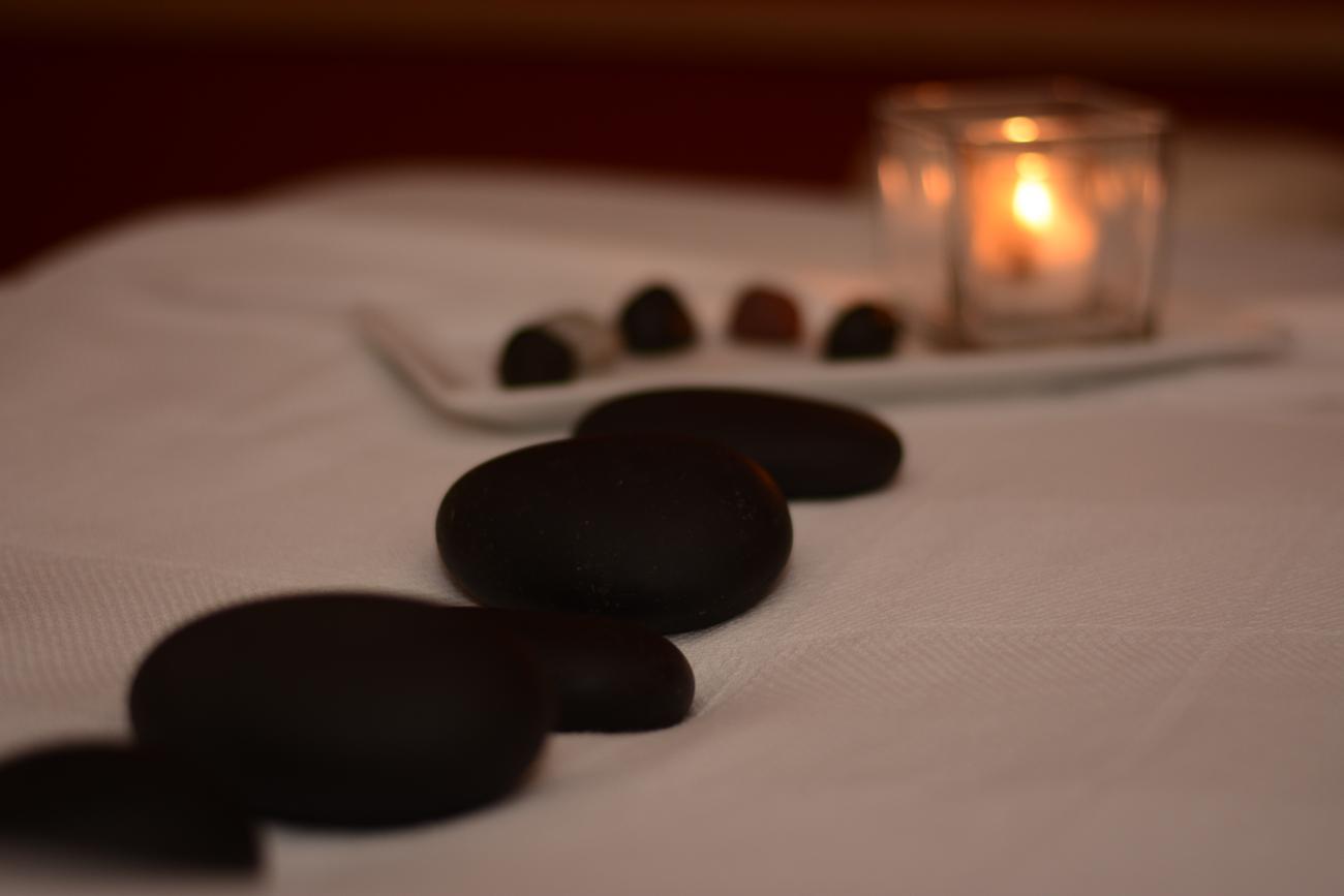 Hot stones and candle